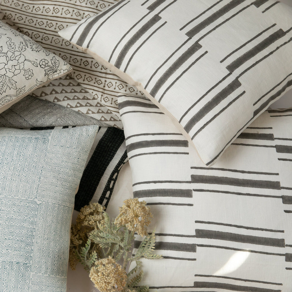 Beni Gray on White Pillow