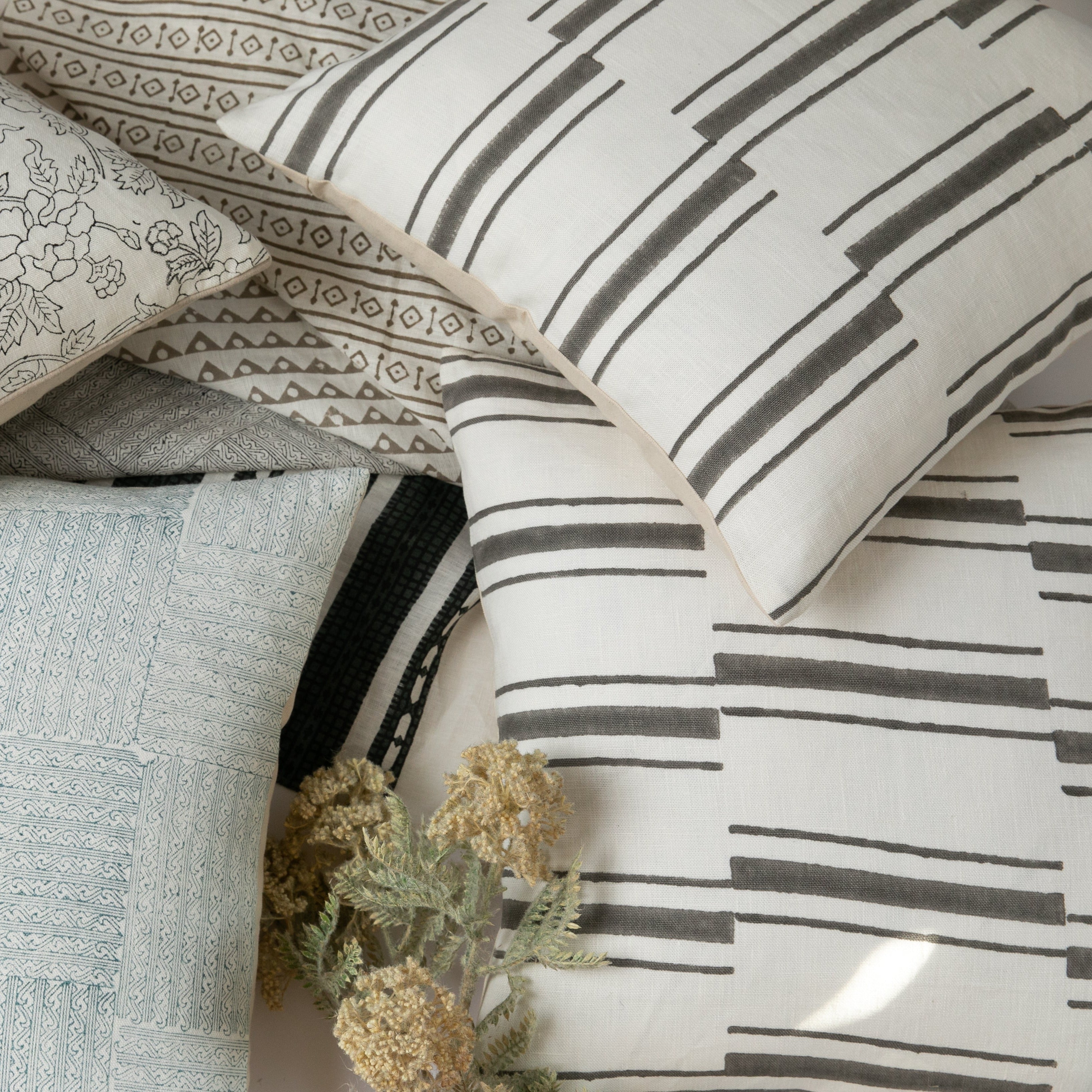 Beni Gray on White Pillow