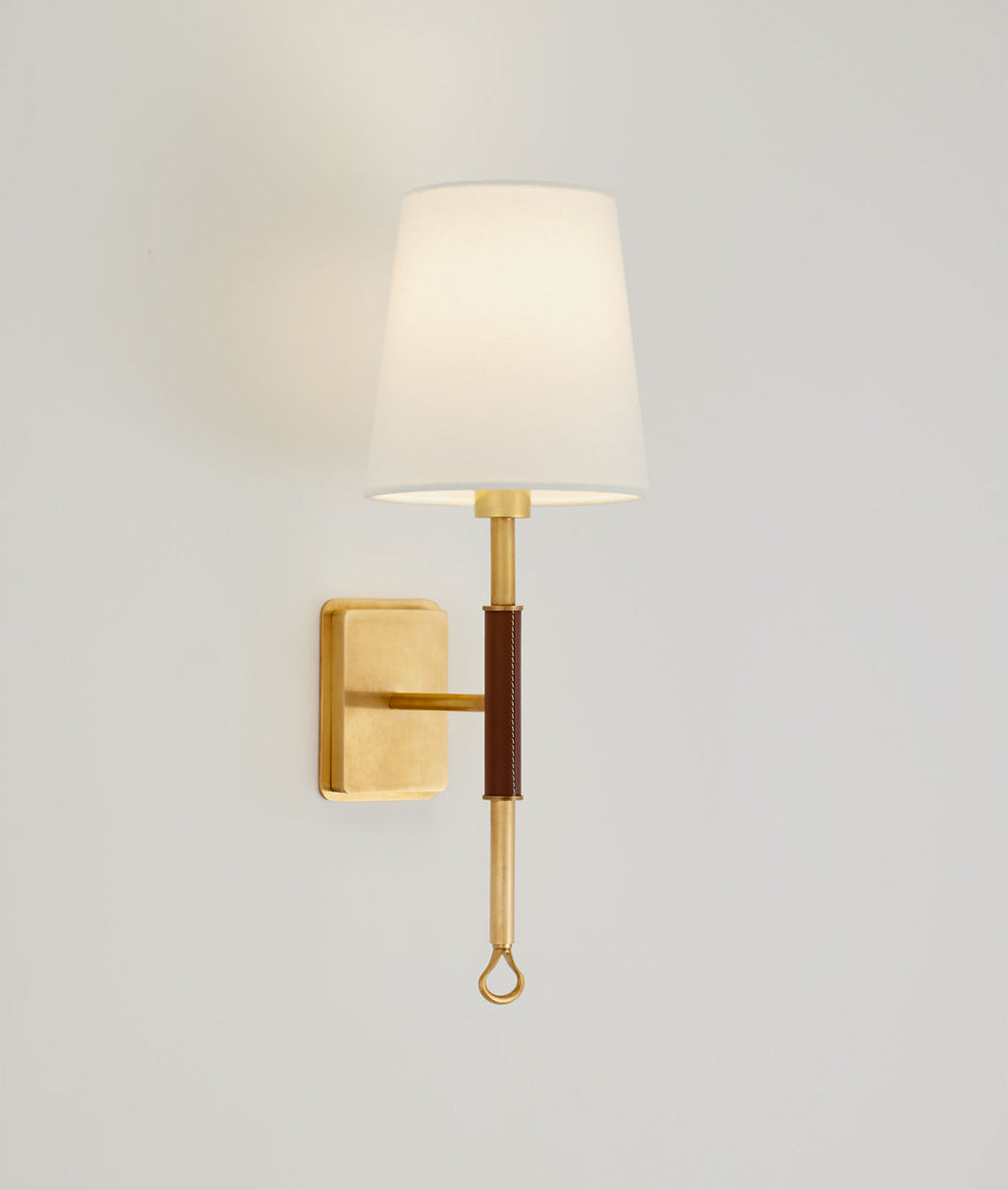 Griffin Sconce | Hand-Rubbed Antique Brass and Saddle Leather | Linen Shade
