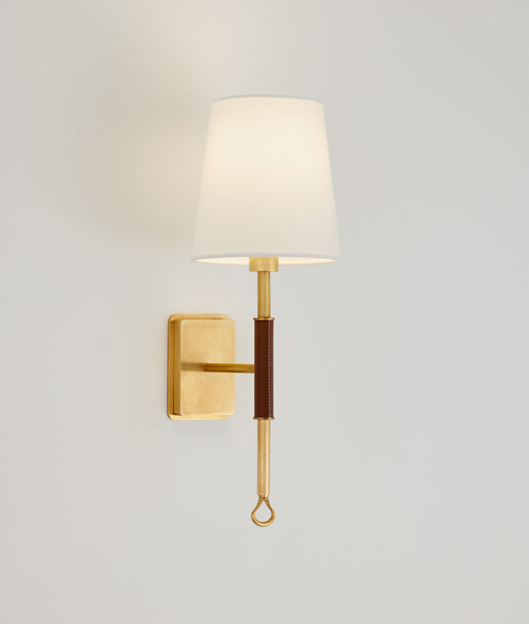Griffin Sconce | Hand-Rubbed Antique Brass and Saddle Leather | Linen Shade