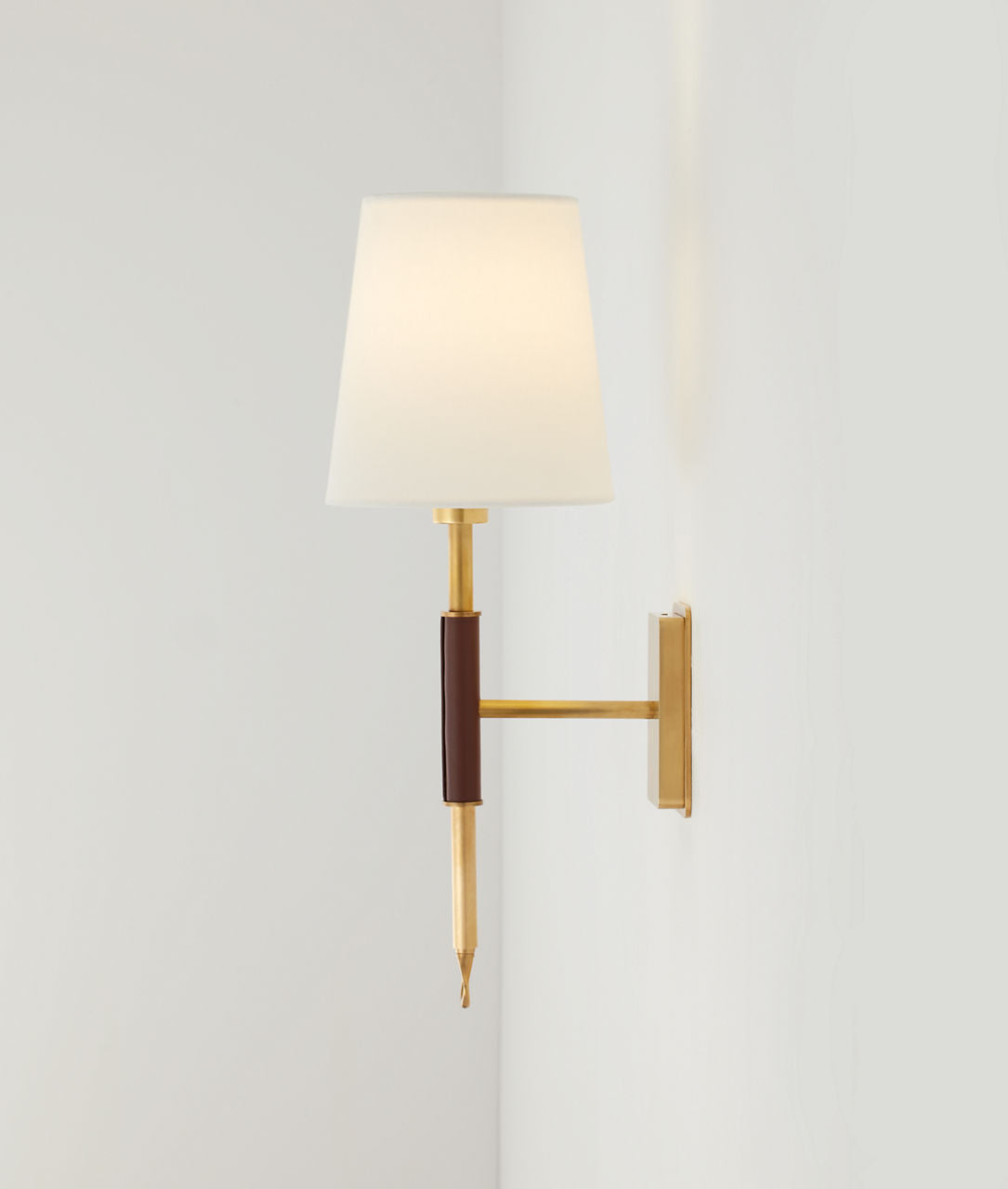 Griffin Sconce | Hand-Rubbed Antique Brass and Saddle Leather | Linen Shade