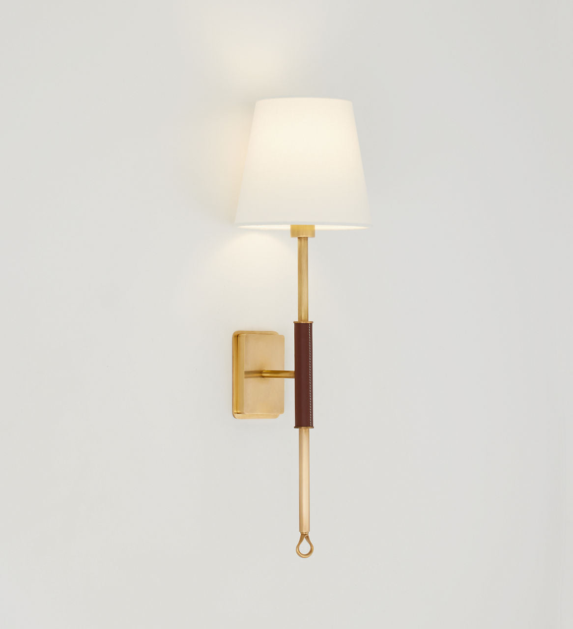 Griffin Tail Sconce | Hand-Rubbed Antique Brass and Saddle Leather | Linen Shade