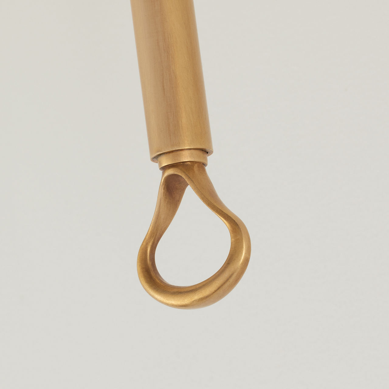 Griffin Tail Sconce | Hand-Rubbed Antique Brass and Saddle Leather | Linen Shade