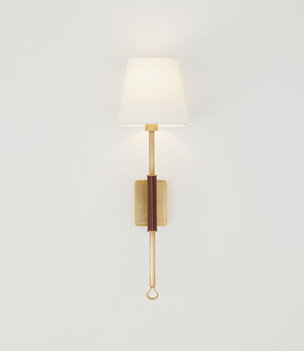 Griffin Tail Sconce | Hand-Rubbed Antique Brass and Saddle Leather | Linen Shade