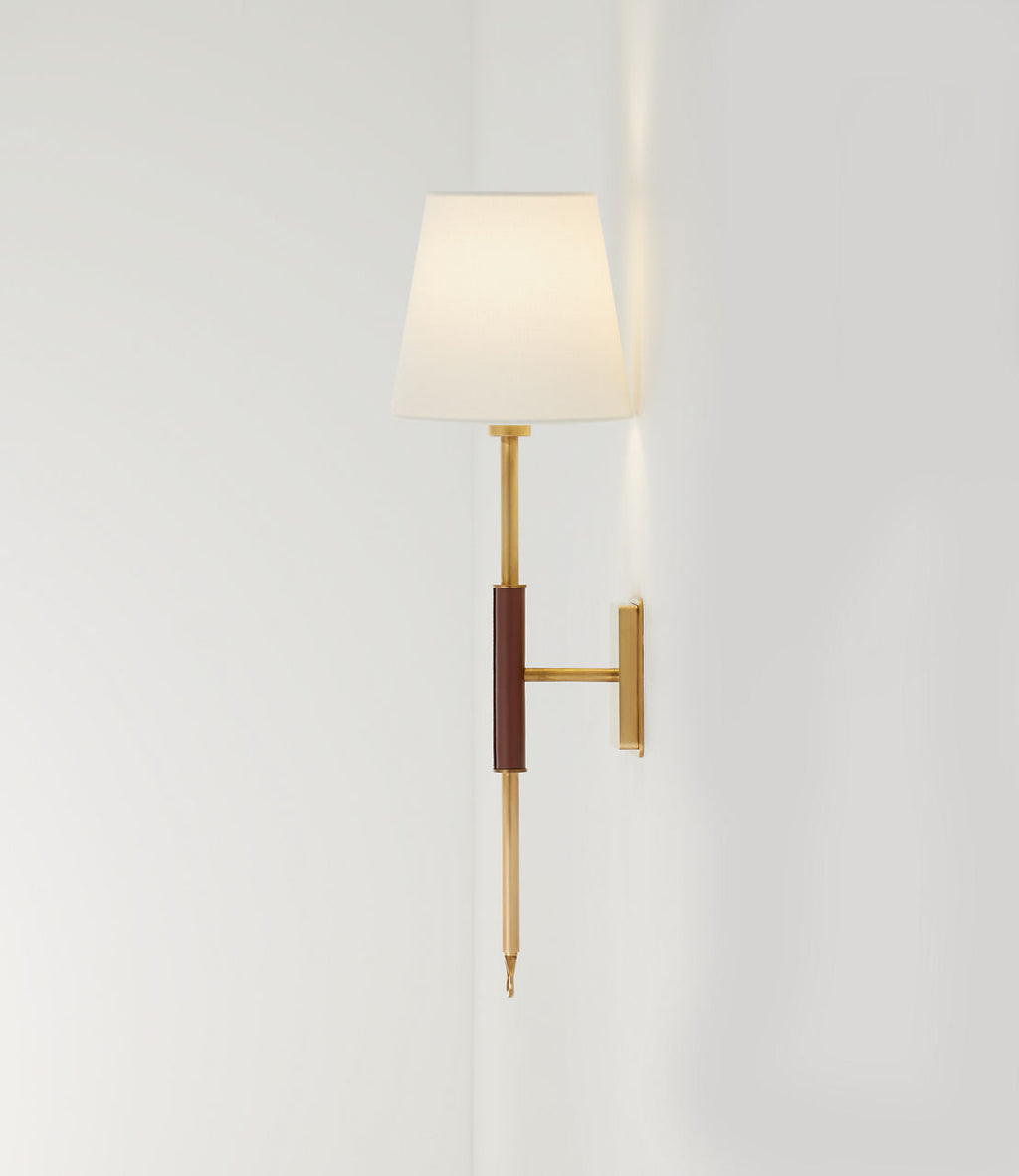 Griffin Tail Sconce | Hand-Rubbed Antique Brass and Saddle Leather | Linen Shade