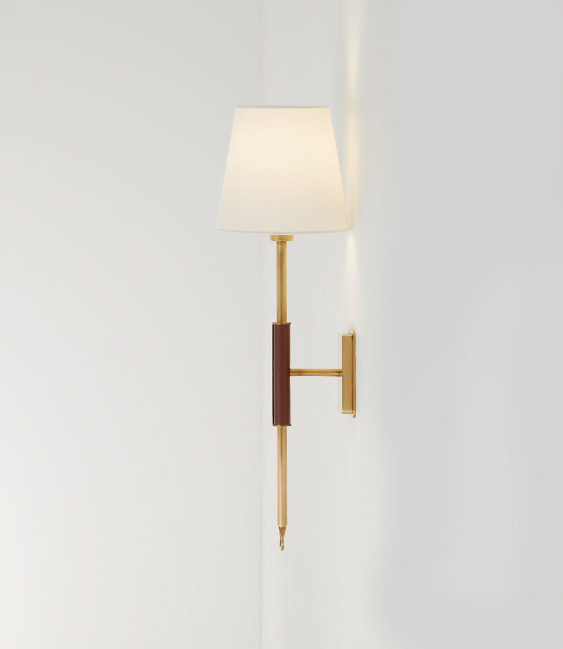 Griffin Tail Sconce | Hand-Rubbed Antique Brass and Saddle Leather | Linen Shade