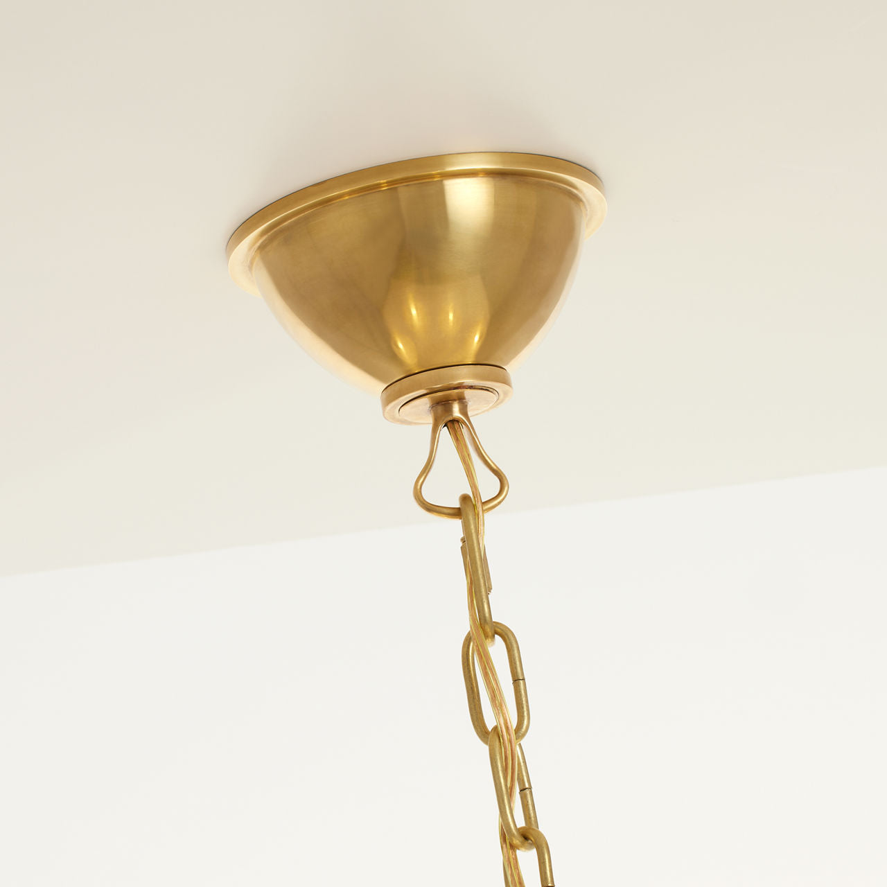 Griffin Large Staggered Tail Chandelier | Hand-Rubbed Antique Brass and Saddle Leather | Linen Shades
