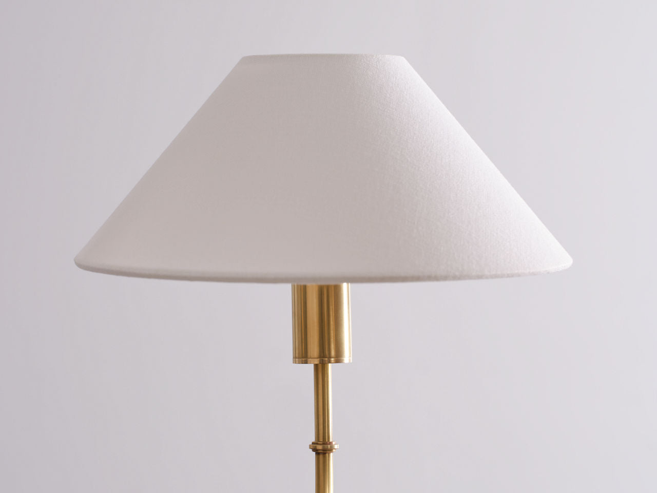 Griffin Grande Tail Chandelier | Hand-Rubbed Antique Brass and Saddle Leather | Linen Shades